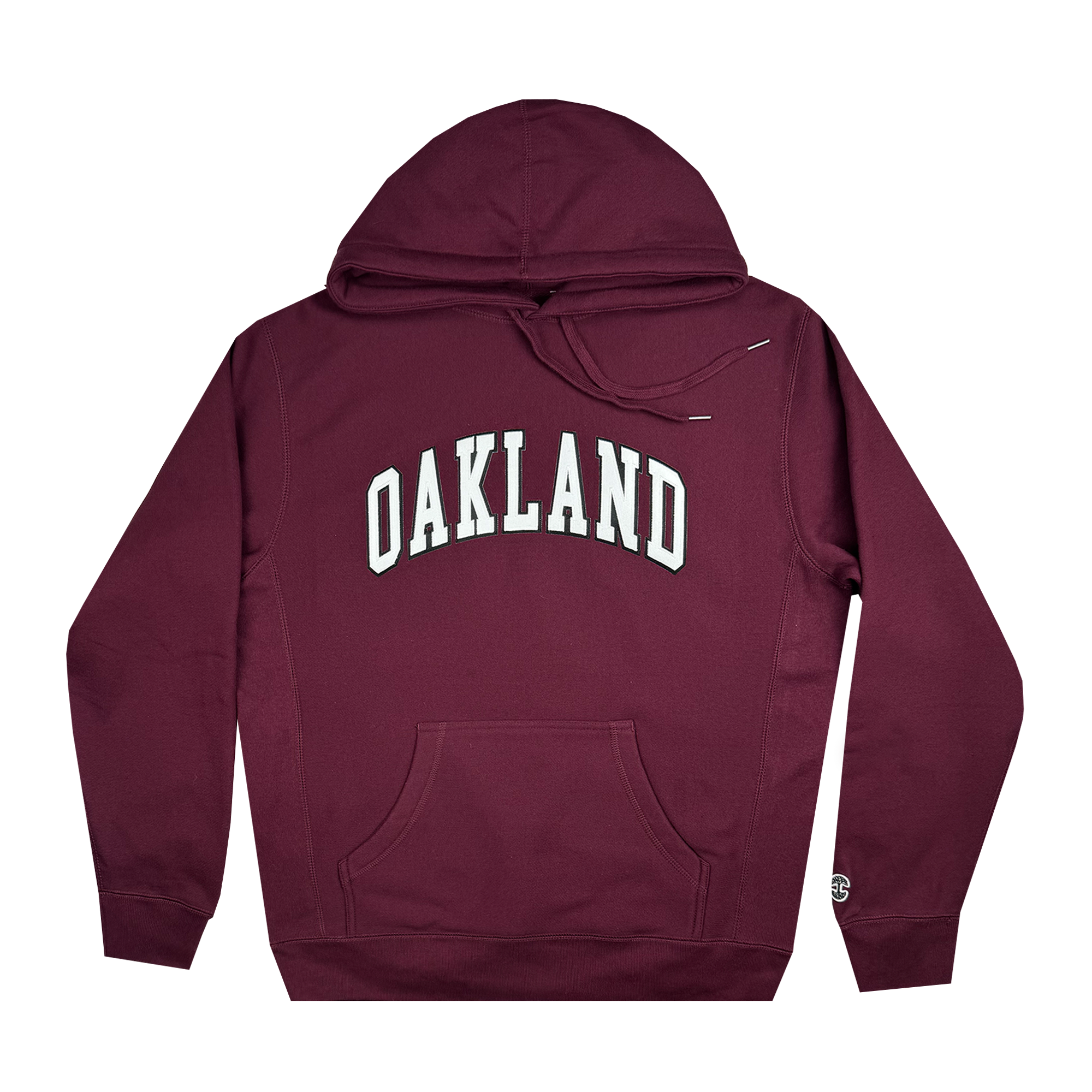 The Alma Mater Heavy Hoodie by Oaklandish is maroon and features the word "OAKLAND" in large white capital letters across the chest. Crafted from premium heavyweight fleece, it includes a front pocket, drawstring hood, and ribbed cuffs and hem for ultimate comfort.