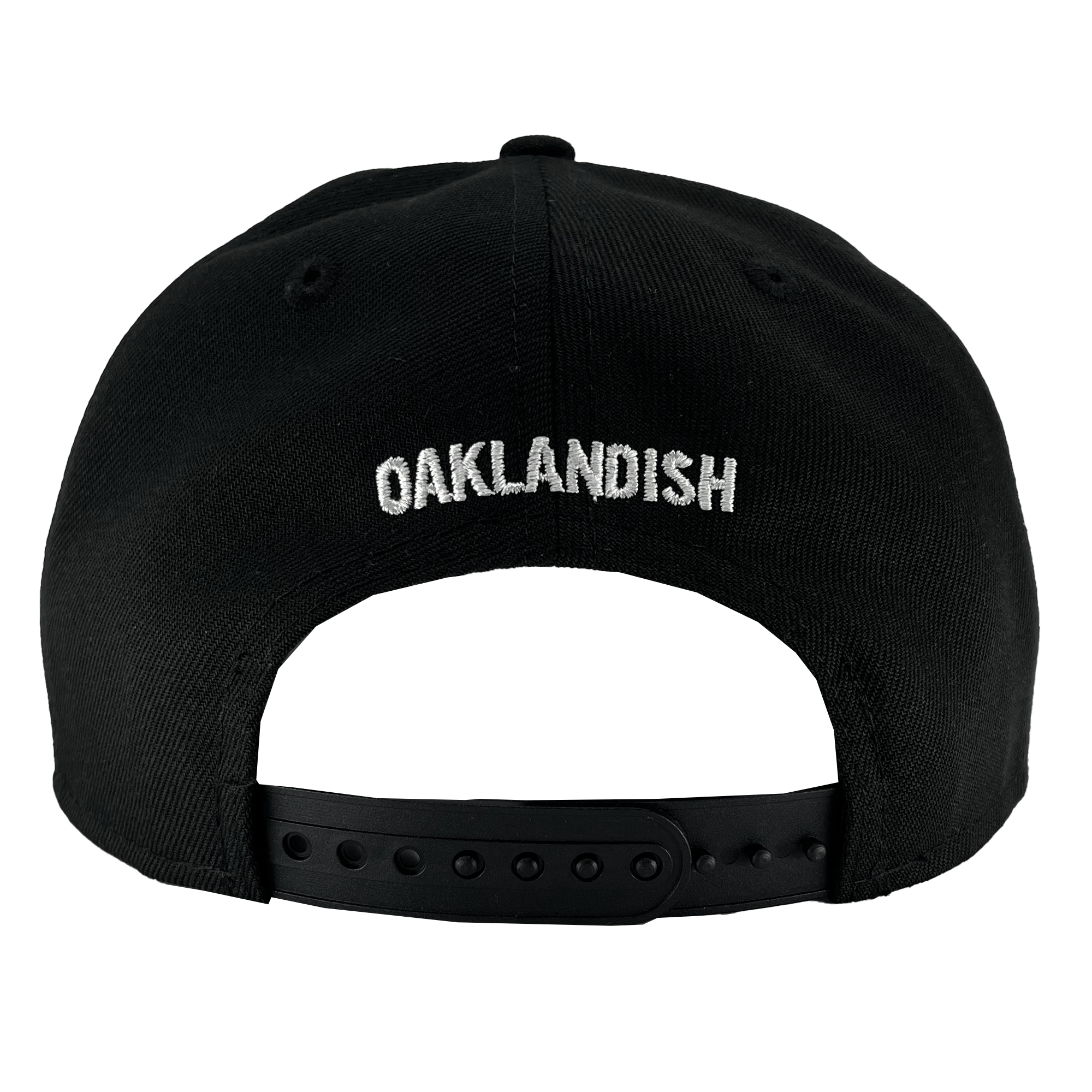 The image shows the rear view of a New Era Oakland Ballers Alt Logo 9FIFTY AF Cap, featuring "OAKLANDISH" embroidered in white uppercase letters on the back panel. This cap, reminiscent of gear worn by the Oakland Ballers, includes a black plastic snapback closure with adjustable holes to accommodate different sizes. The fabric appears thick and sturdy.