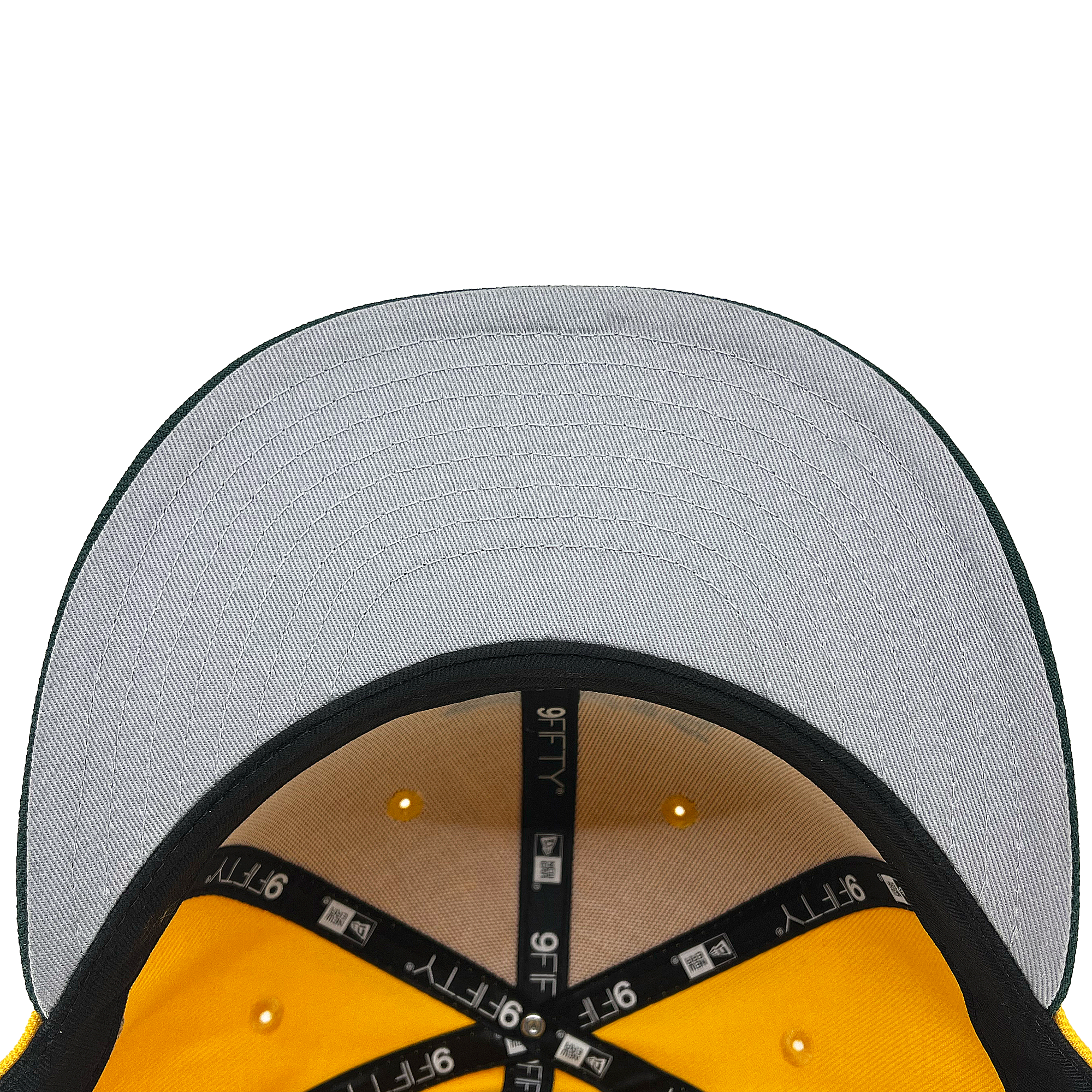 Top view of the inside of a New Era Oakland Ballers 9FIFTY Cap, perfect for any Oakland Ballers fan. The underside of the brim is grey, and the inner bands are black with white "9FIFTY" text. The yellow panels have ventilation holes, showcasing the hat’s internal structure and stitching.