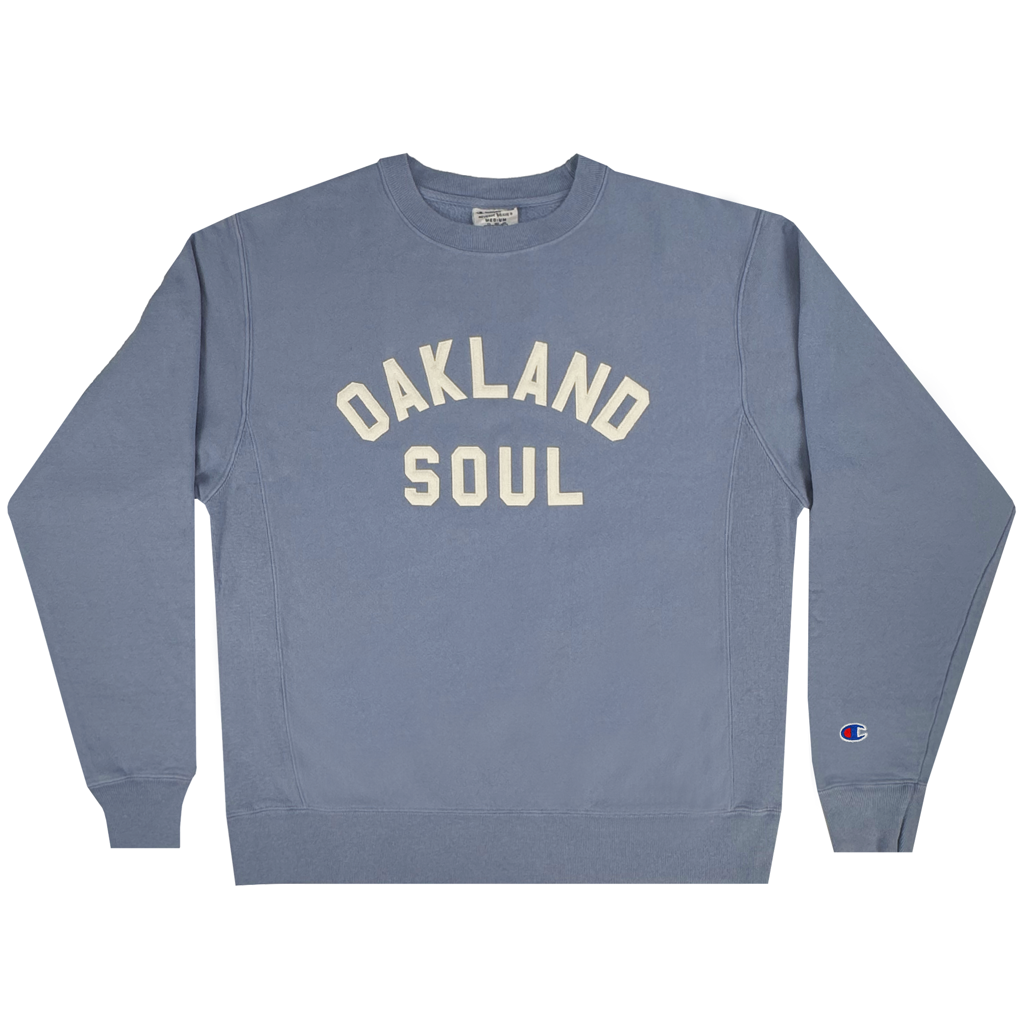 Celebrate women's soccer spirit with the Champion X Oakland Soul Wordmark Crew sweatshirt. It features "OAKLAND SOUL" in large white letters, the Champion logo on the lower left sleeve, and offers a casual comfort with its crew neck and ribbed cuffs for USL W-League fans.