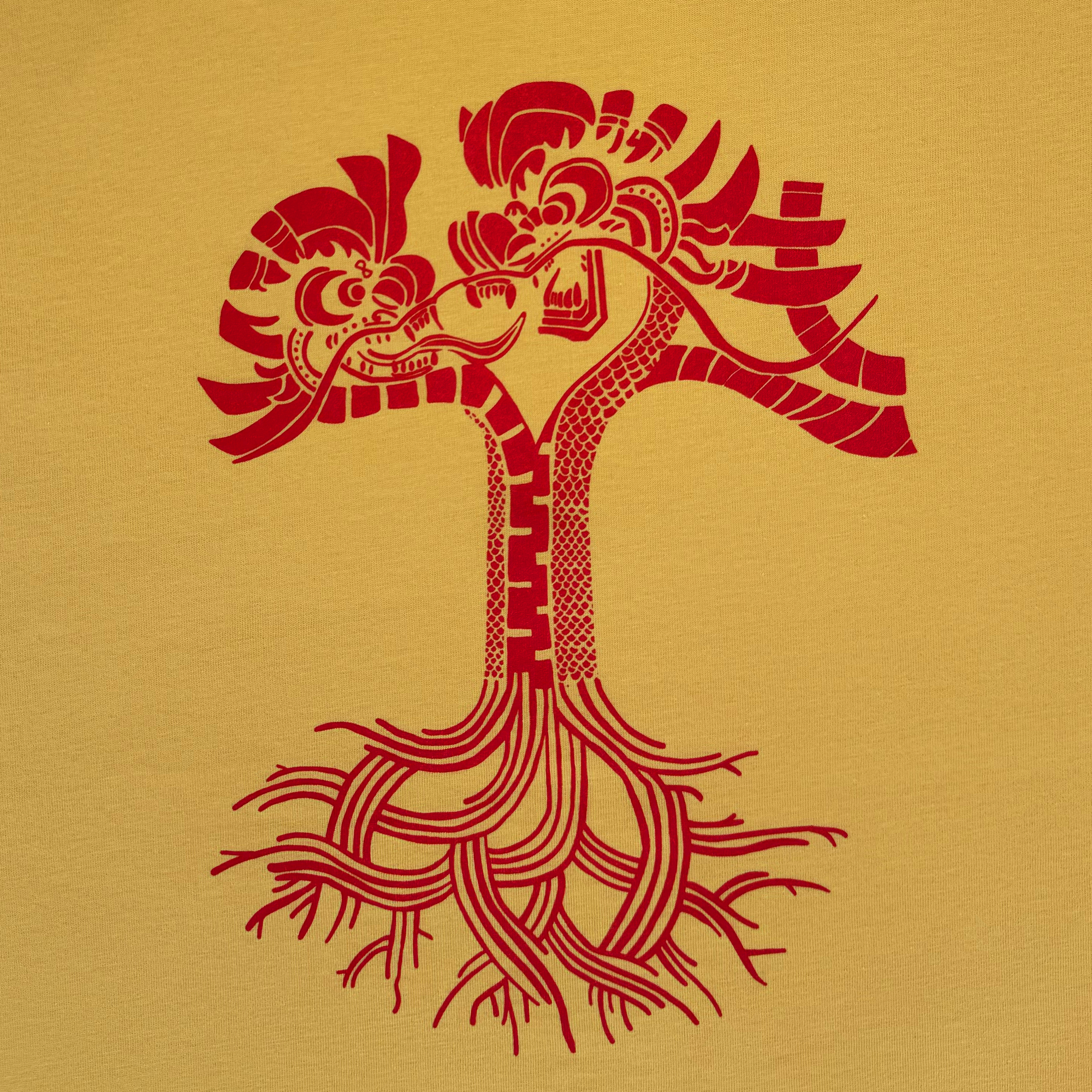 The Dragon Power Tee by Oaklandish features a stylized tree with intricate trunks forming a heart reminiscent of dragons celebrated in Oakland Chinatown, set against a mustard yellow backdrop with red branches and roots that blend geometric and organic patterns.