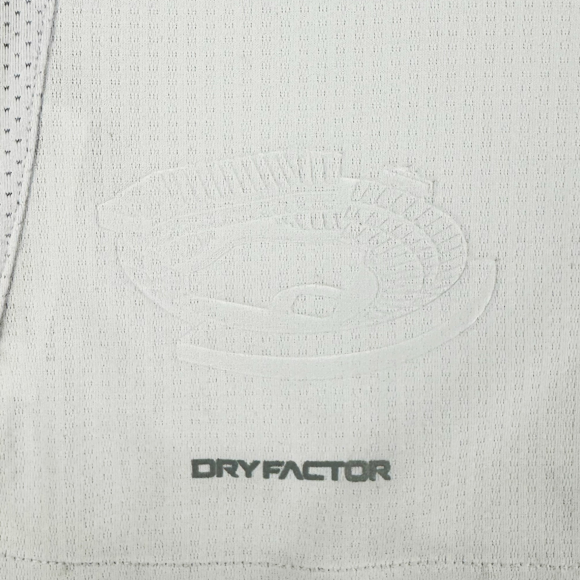 The Unisex Oakland Roots SC 2025 Second Kit by Oakland Roots SC features a light grey jersey with an embossed bowl logo surrounded by "MADE FOR THE GRIDIRON," and "DRYFACTOR" below. It includes ventilation holes, drawing on Oakland sports history's focus on performance and durability.