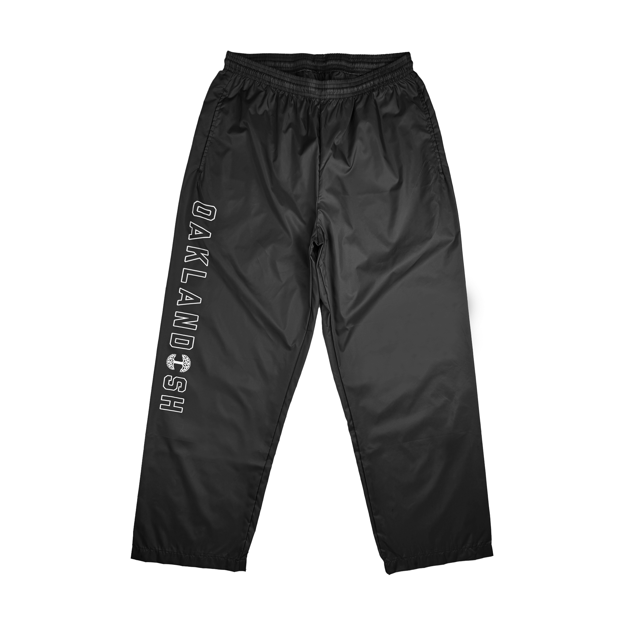 Introducing the Bandit Nylon Pant from Oaklandish, featuring an adjustable waistband and relaxed fit. The pants showcase "OAKLANDISH" printed in bold, white capital letters along the left leg. Crafted from lightweight nylon taffeta, they have a slightly shiny finish that's perfect for both casual and athletic wear.