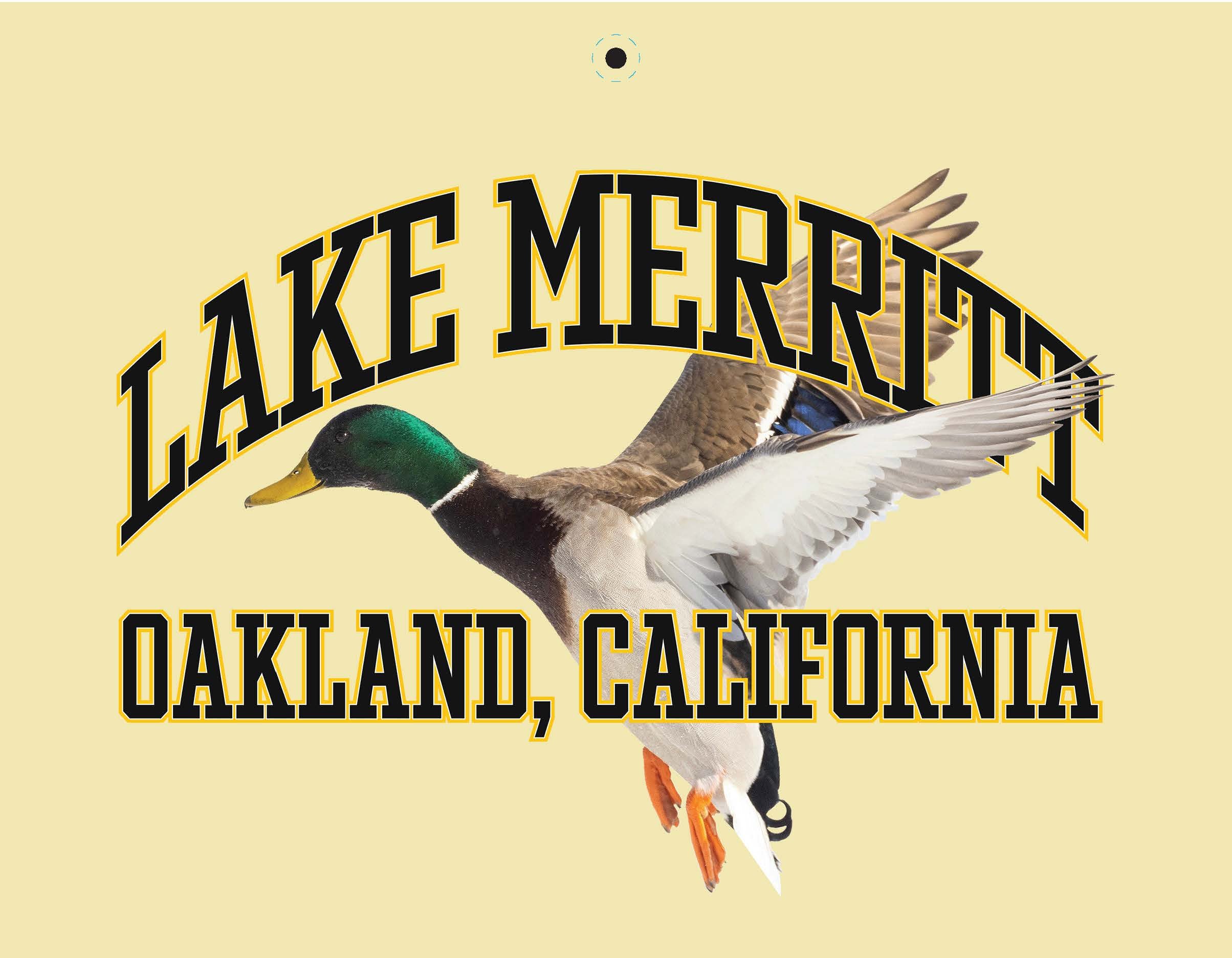 Illustration of a mallard duck in flight over bold text "LAKE MERRITT" with an arc and "OAKLAND, CALIFORNIA" below. This Oaklandish 2025 Calendar piece features a circular design on a pale yellow background, perfect for your collection.