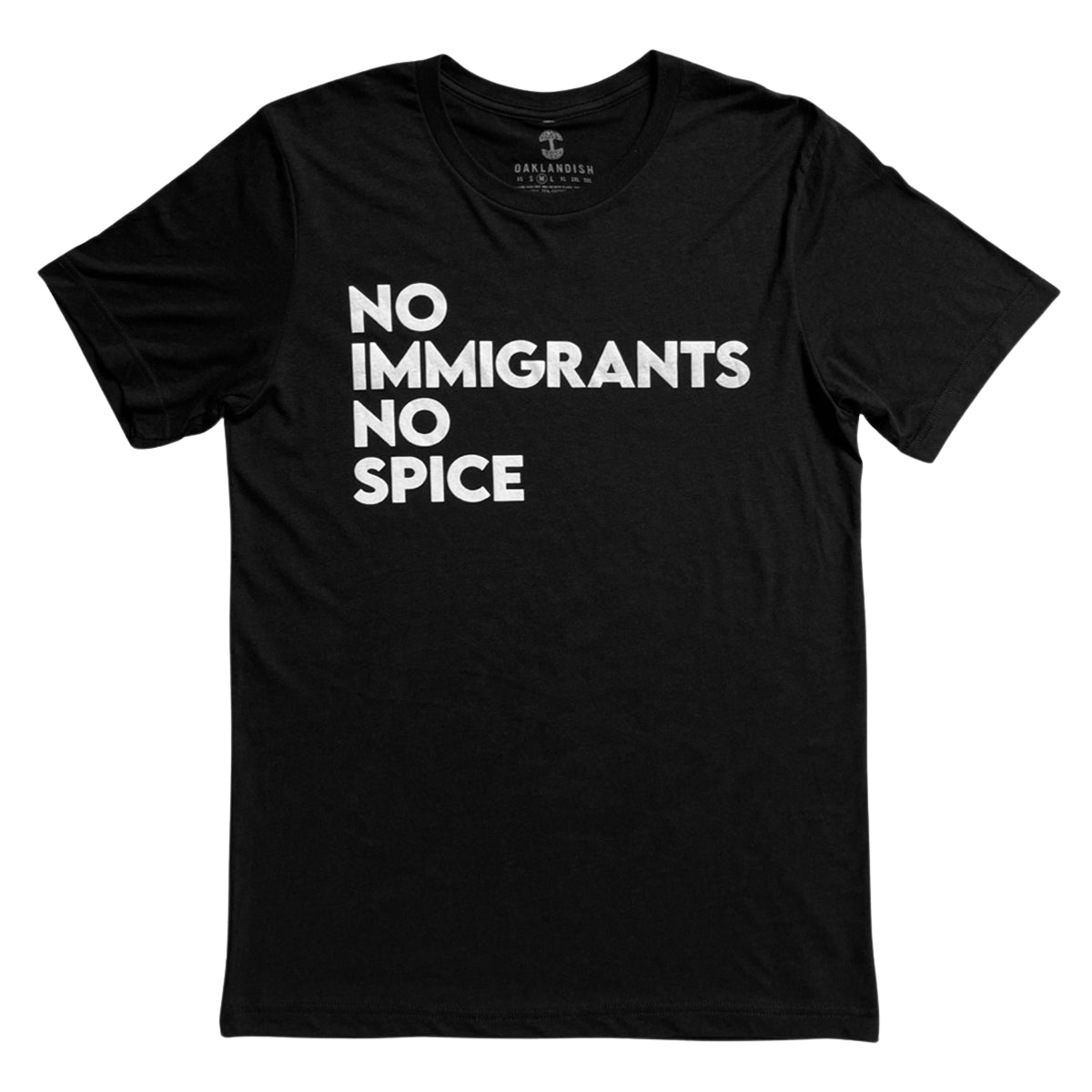 The NINS Classic Tee by Oaklandish features a round neck and short sleeves, with bold white text that reads "NO IMMIGRANTS NO SPICE" arranged in three lines against its black fabric. Faintly branded inside the collar, this shirt proudly supports immigrant rights and is presented laid flat against a plain white background.