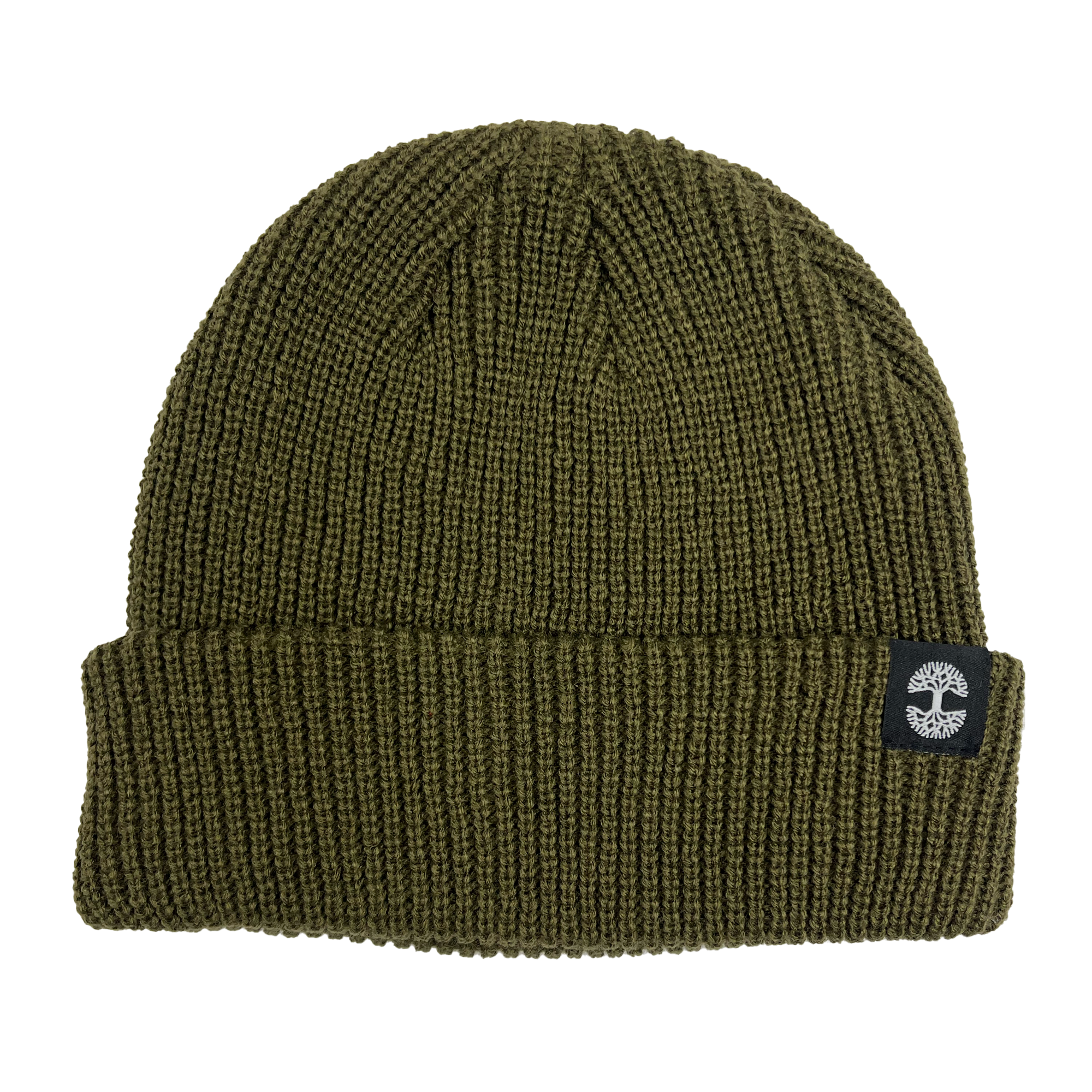 The Ramos Beanie by Oaklandish is a green knit short beanie with a folded brim. It features a black patch displaying a white tree logo and is made from woven acrylic. The ribbed texture adds to its cozy look, and the headwear piece is photographed laying flat on a white background.