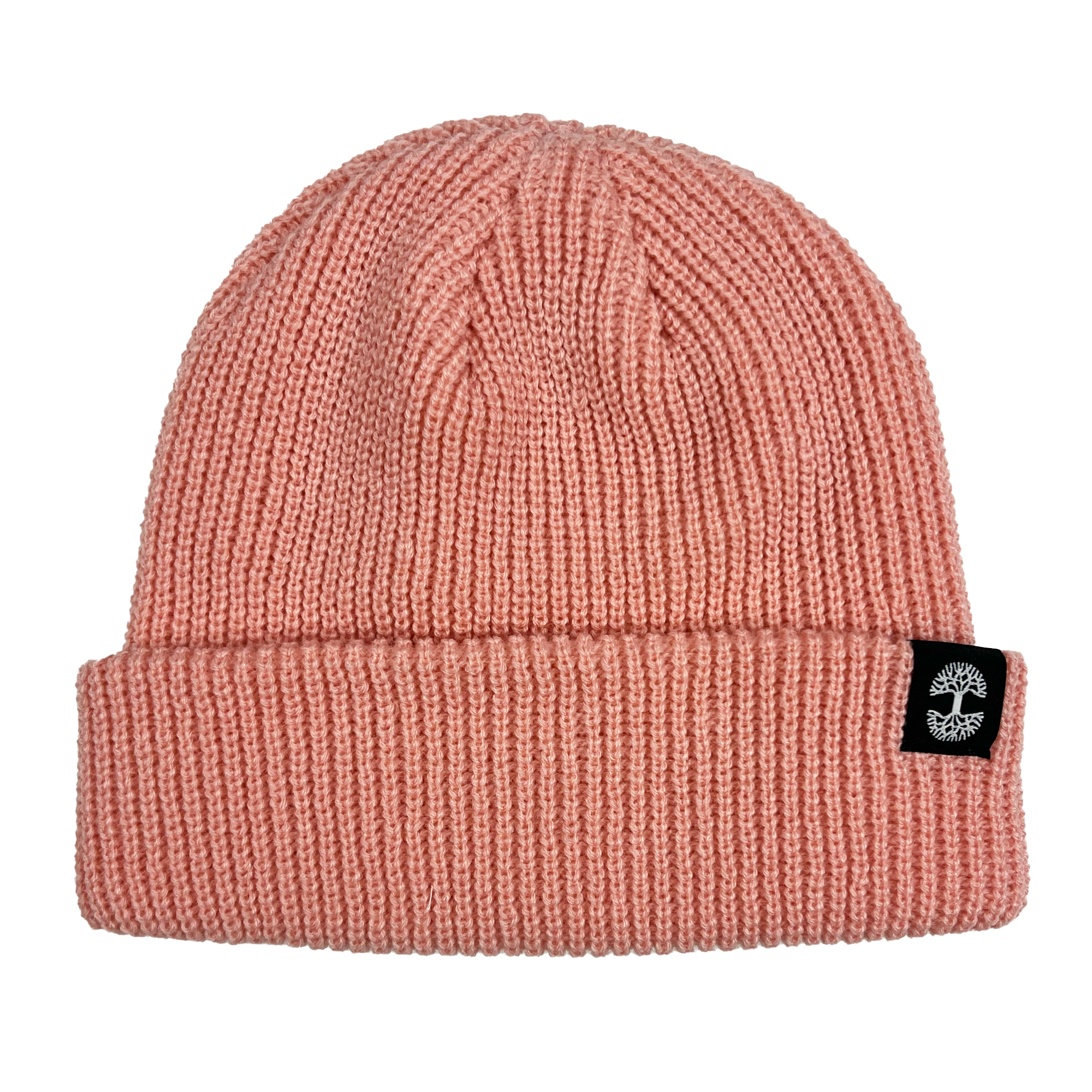 The Ramos Beanie by Oaklandish is a pink, knitted beanie with a ribbed texture and a folded brim. The brim features a small black patch with a white circular logo on the right side, giving it a stylish touch. This woven beanie appears soft and cozy, making it perfect for keeping warm in cold weather.