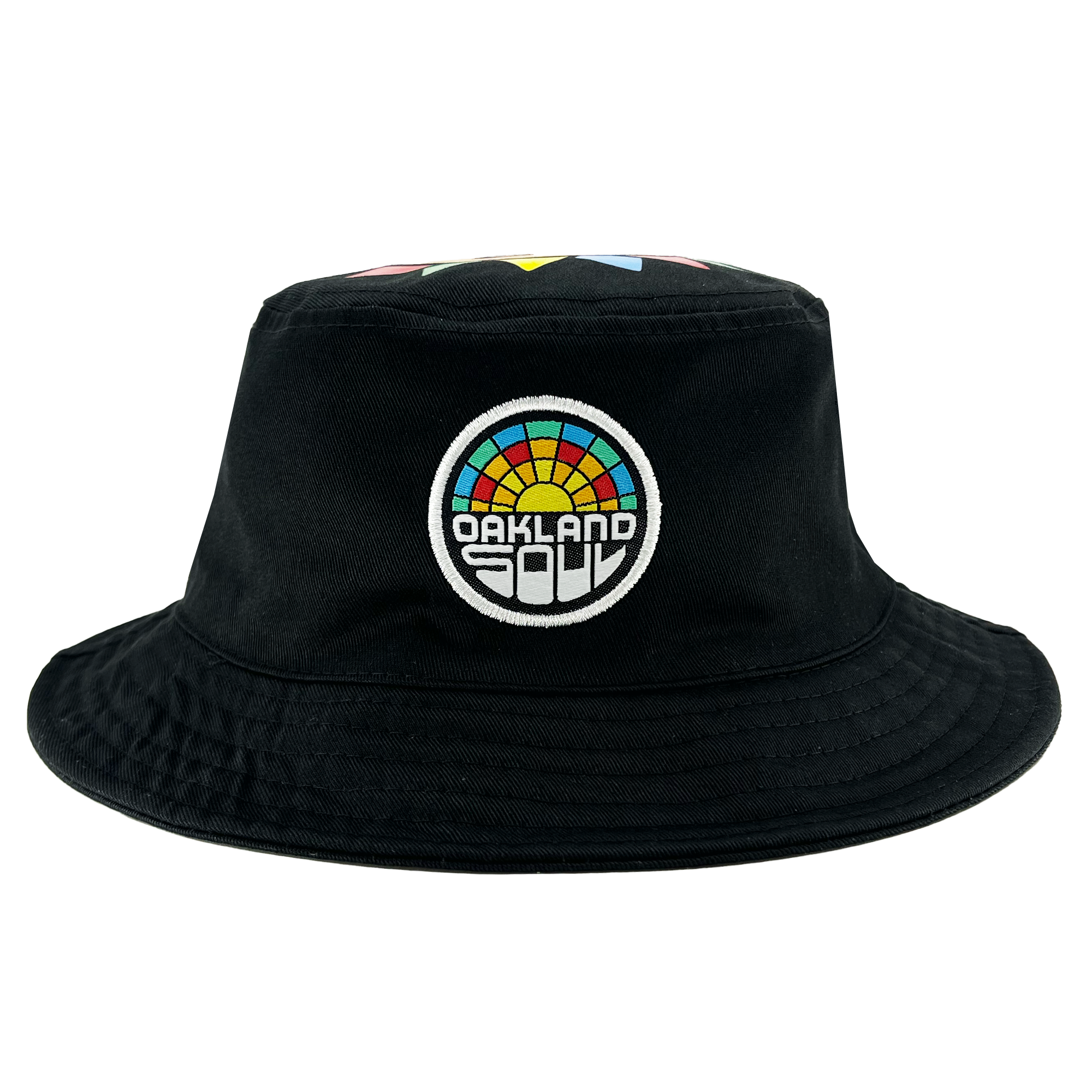 Introducing the Oakland Soul & Roots SC Reversible Bucket from Oakland Roots SC—a stylish black bucket hat that boasts a vibrant embroidered patch on the front. The circular patch features a rainbow of colors and displays the words "OAKLAND SOUL" within it. With its wide brim and robust, simple fabric, this hat offers both casual elegance and sturdy functionality.