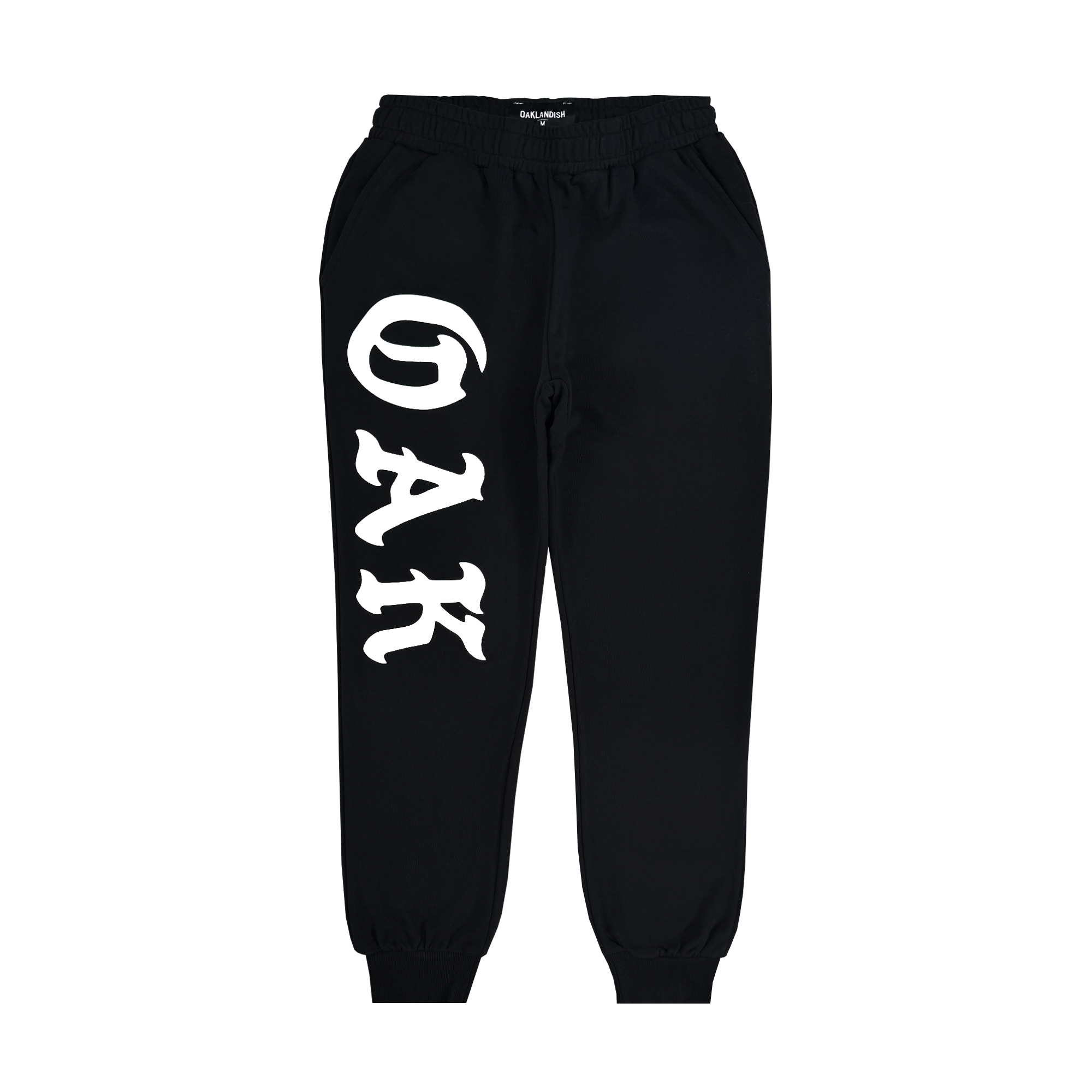 Men's black Roble Joggers by Oaklandish with an elastic waist and cuffs, featuring bold white "G A K" lettering down the left leg. These joggers have a sporty, casual look against a plain white background.