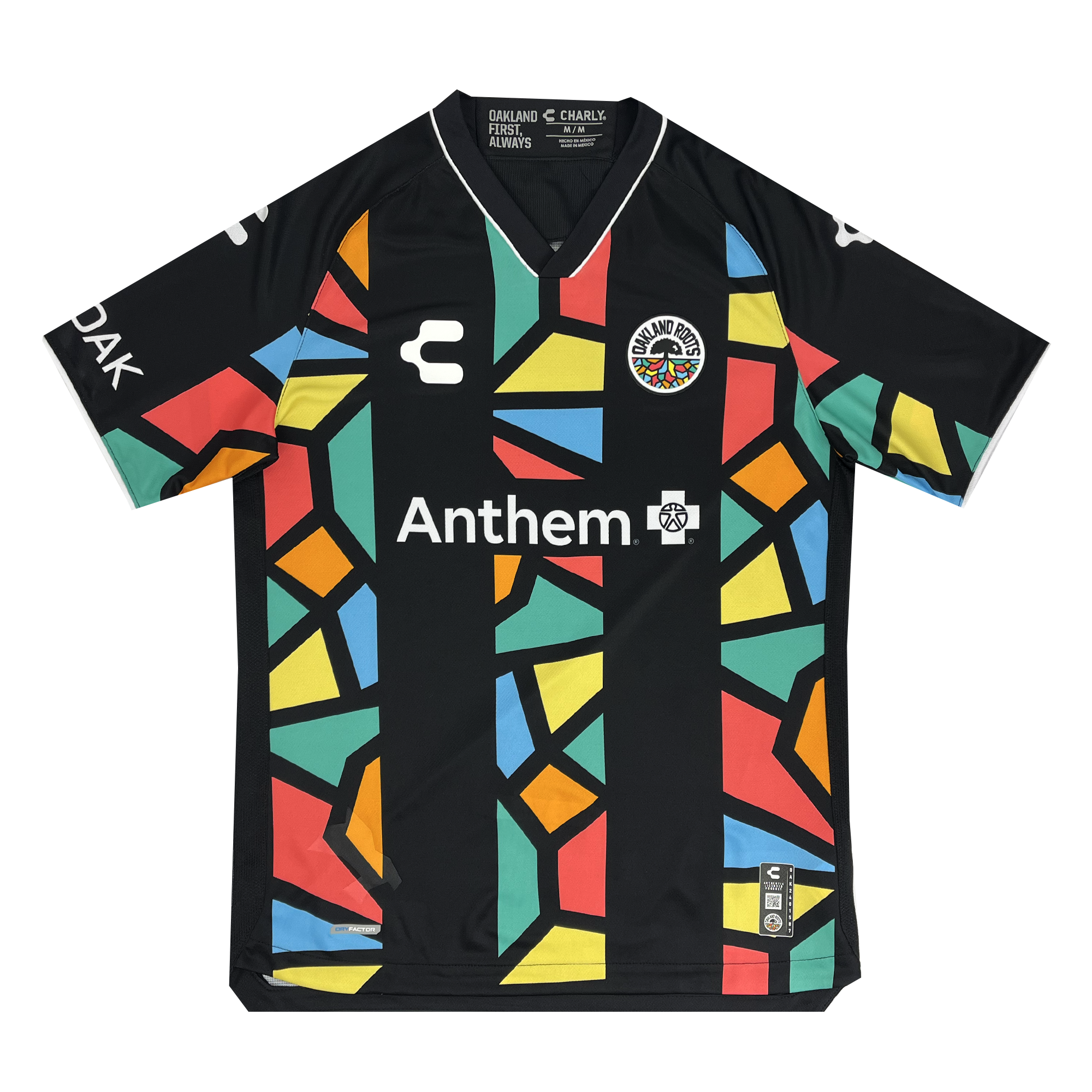 The Unisex Oakland Roots SC 2025 First Kit features a black base with vibrant, geometric patterns in yellow, red, green, and blue. It includes a multicolored circular logo and "Anthem" text on the chest. White sponsor logos are on each sleeve. The collar and cuffs are black outlined in white.