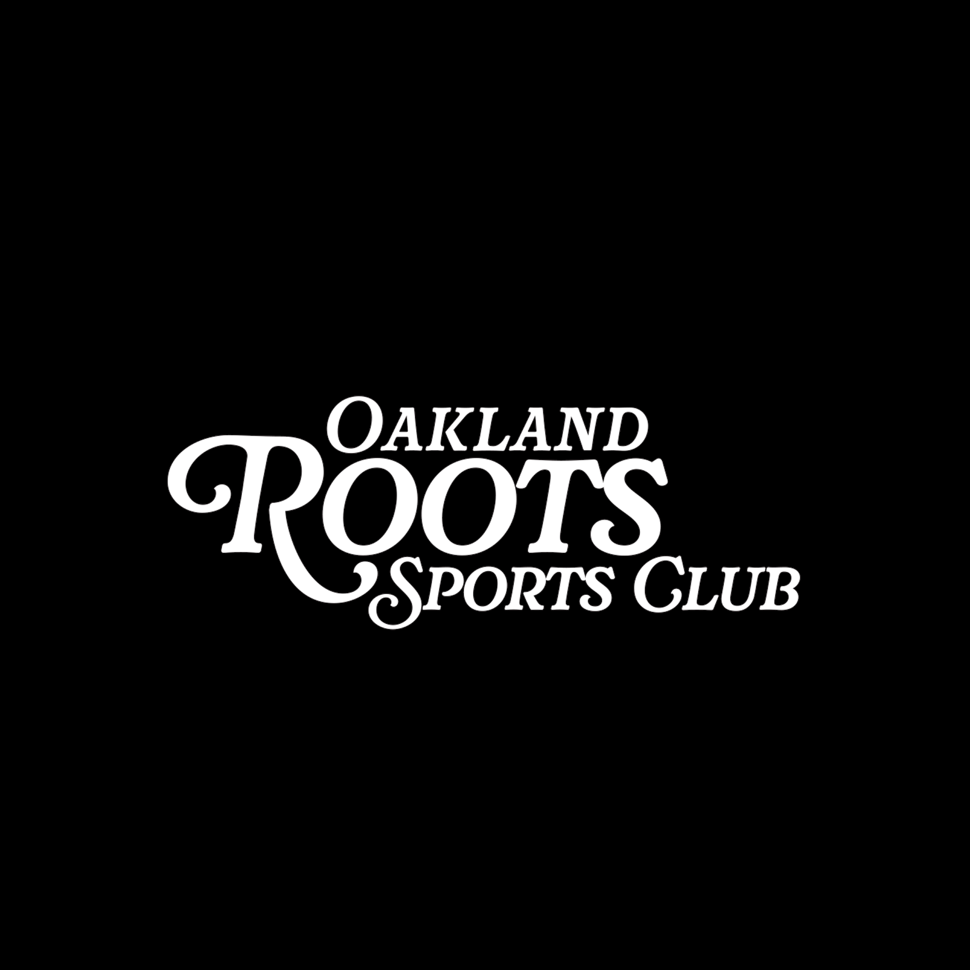 A logo on a solid black background features the words "Oakland Roots SC" in a stylized white font. The word "Roots" is prominently displayed in a larger, cursive style, while "Oakland" and "SC" are in a more standard, uppercase font above and below "Roots," respectively. Emphasizing social good, Oakland Roots SC stands out as more than just sportswear, exemplified by their Legacy Golf Tee.