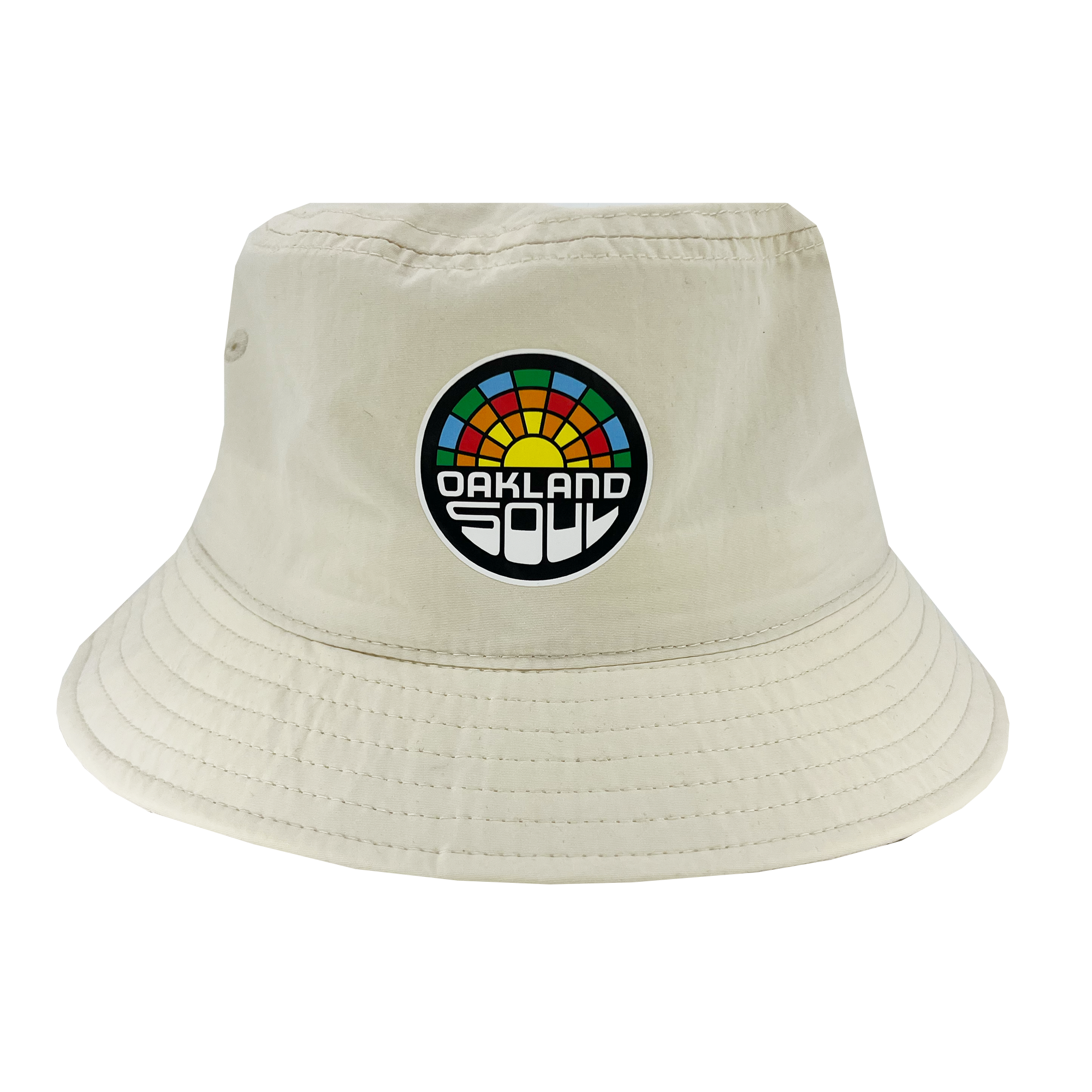 The Oakland Soul Logo Bucket Hat, a beige hat adorned with the "Oakland Soul" logo on the front, celebrates our local women's soccer team in the USL W-League. The logo features a vibrant, semi-circular sunset design with "Oakland Soul" prominently displayed in bold black and white letters below it. Visible stitching around the brim adds to its detail.