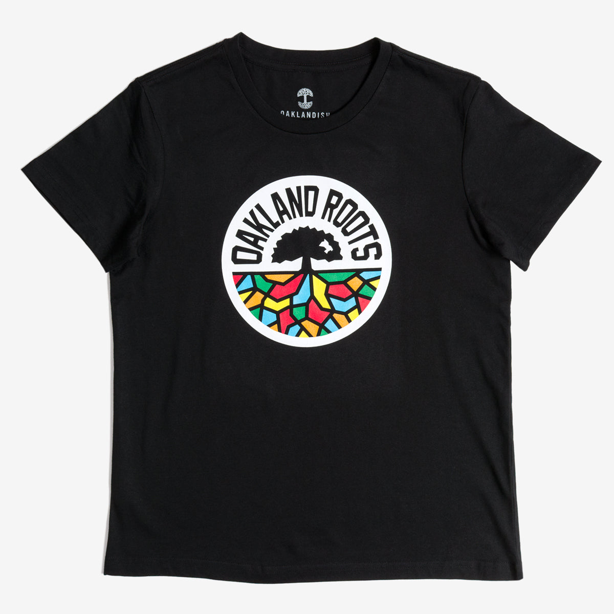 The Women's Oakland Roots SC Classic Tee by Oakland Roots SC is a black t-shirt made from 100% cotton. It prominently features the "Oakland Roots" logo centered on the front. The logo showcases a stylized tree above geometric roots, filled with vibrant shapes in red, blue, yellow, and green. Surrounding the tree are the words "Oakland Roots" in bold, black text on a white background.