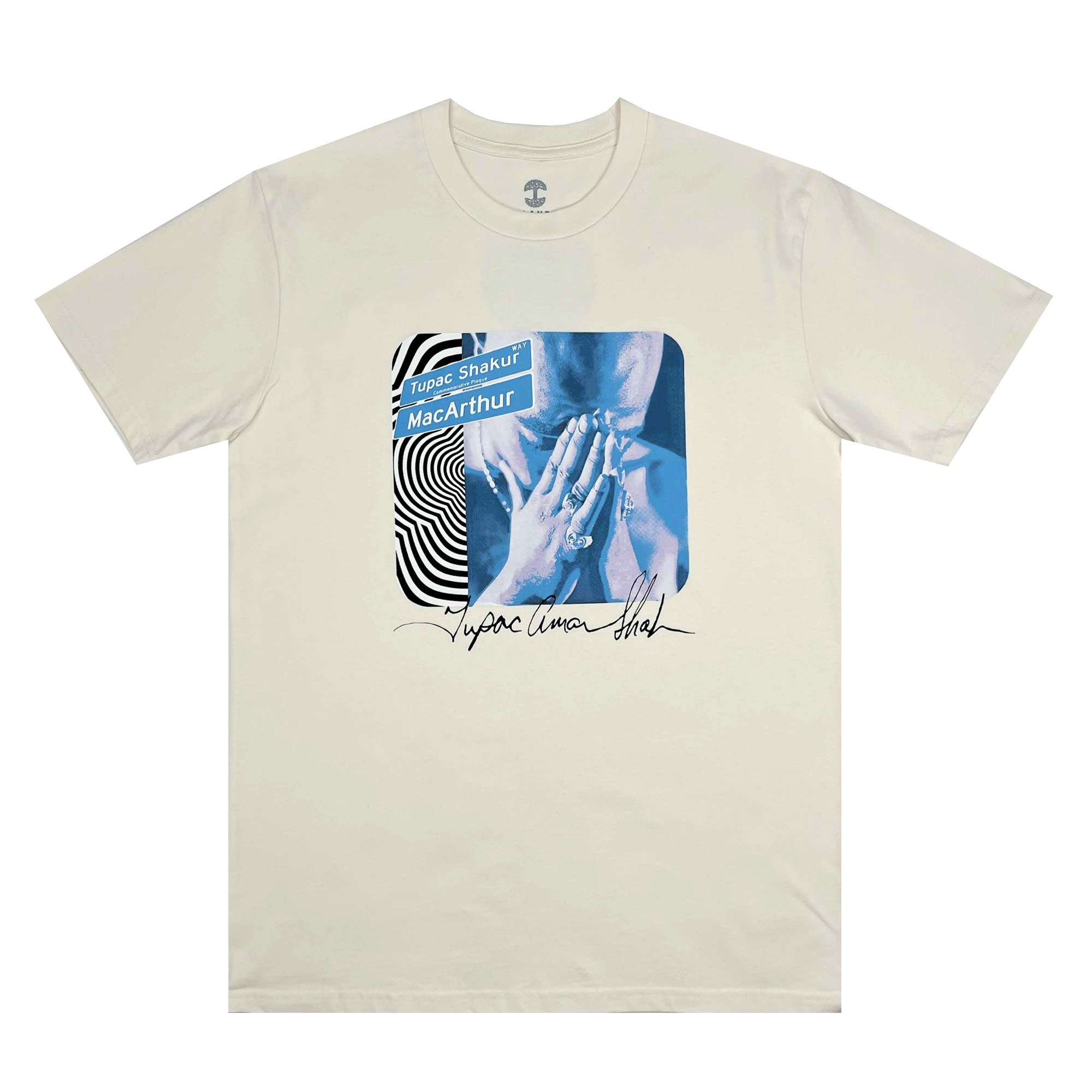 The Wavy Tupac Tee from Oaklandish features a beige t-shirt with a blue-toned image of a person in a prayer pose, capturing the essence of hip-hop. "Tupac Shakur" and "MacArthur" are displayed above on a wavy background, while "Tupac Amaru Shakur" is signed artistically beneath. This design honors Tupac's Oakland roots on the chest area.